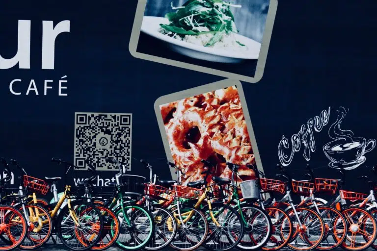 A cafe with a group of bicycles parked in front, maximizing QR code efficiency in marketing campaigns.