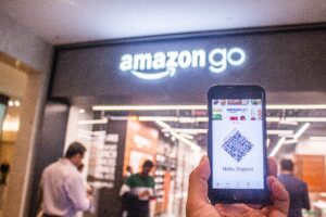 A person utilizing QR codes while shopping at an Amazon Go store.